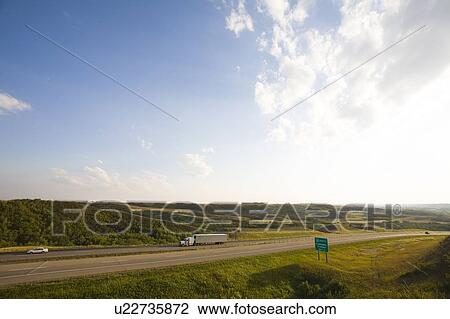 Stock Image - Double lane highway through Saskatchewan. Fotosearch