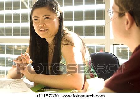 Female student seated, talking, in front of solar panelled windows, Winnipeg, Canada View Large Photo Image Stock Image - Female student seated, talking, in front of solar panelled windows, Winnipeg, Canada. Fotosearch