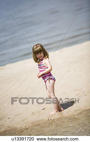 Girl, (4) in bathing suit at beach, Grand Beach Provincial Park, Manitoba, Canada View Large Photo Image Stock Image - Girl, (4) in bathing suit at beach, Grand Beach Provincial Park, Manitoba, Canada. Fotosearch