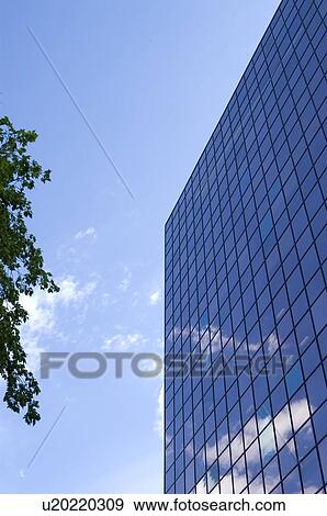 Glass pane office building with blue sky and clouds, Winnipeg, Canada View Large Photo Image Stock Photo - Glass pane office building with blue sky and clouds, Winnipeg, Canada. Fotosearch
