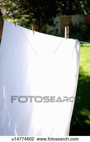 Stock Image - Hanging laundry outdoors, Regina, Saskatchewan. Fotosearch