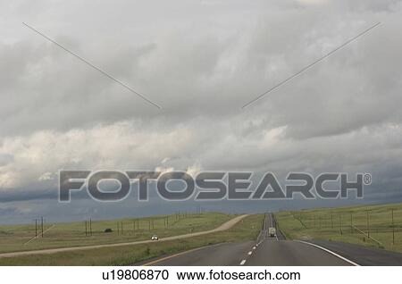 Stock Image - Heading West on Trans Canada Highway near Red Deer; Canada, Alberta. Fotosearch