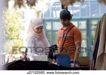 Islamic young couple at an outdoor market, Winnipeg, Canada View Large Photo Image Stock Image - Islamic young couple at an outdoor market, Winnipeg, Canada. Fotosearch
