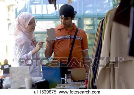 Islamic young couple at an outdoor market, Winnipeg, Canada View Large Photo Image Stock Photography - Islamic young couple at an outdoor market, Winnipeg, Canada. Fotosearch