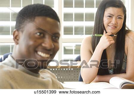 Male student foreground, female student background, in front of solar panelled windows, Winnipeg, Canada View Large Photo Image Stock Photo - Male student foreground, female student background, in front of solar panelled windows, Winnipeg, Canada. Fotosearch
