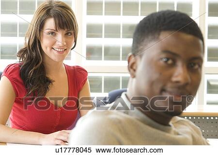 Male student foreground, female student background, in front of solar panelled windows, Winnipeg, Canada View Large Photo Image Stock Photography - Male student foreground, female student background, in front of solar panelled windows, Winnipeg, Canada. Fotosearch