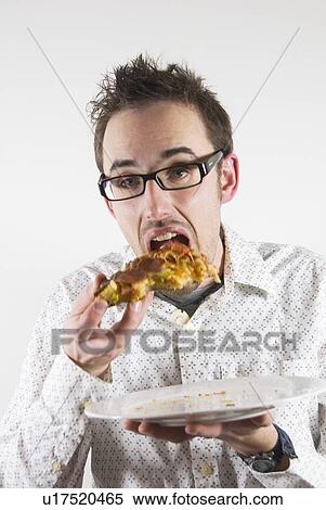 Stock Photography - Man eating pizza. Fotosearch