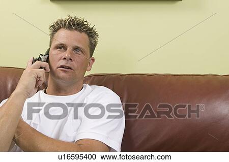 Stock Image - Man on cellphone.. Fotosearch