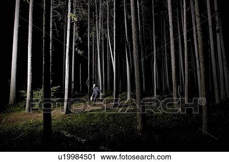 Man running in forest at night wearing gas mask and carrying large briefcase View Large Photo Image Stock Image - Man running in forest at night wearing gas mask and carrying large briefcase. Fotosearch