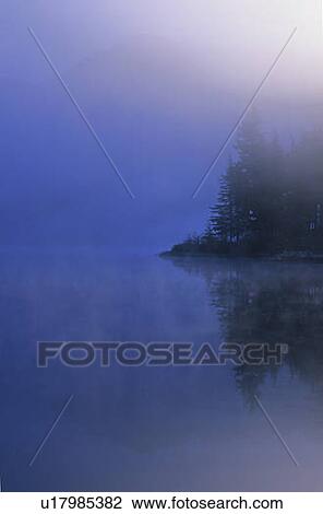 Mist rises in front of purple mountain behind Green Lake, Whistler, BC Canada View Large Photo Image Stock Image - Mist rises in front of purple mountain behind Green Lake, Whistler, BC Canada. Fotosearch