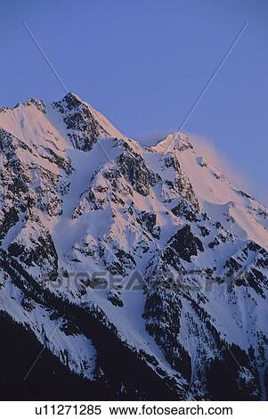 Mount Currie rises above Pemberton Valley, alpenglow lights snow, Pemberton, BC Canada View Large Photo Image Stock Photography - Mount Currie rises above Pemberton Valley, alpenglow lights snow, Pemberton, BC Canada. Fotosearch
