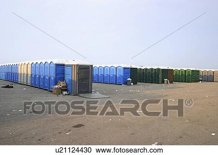 Portable toilets on the grounds after a rock concert, SARS concert in Toronto View Large Photo Image Stock Image - Portable toilets on the grounds after a rock concert, SARS concert in Toronto. Fotosearch