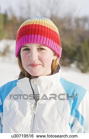 Stock Photograph - Portrait of 13 year old girl, outdoor, winter, Wininpeg, Canada. Fotosearch
