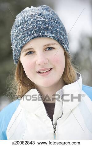 Stock Image - Portrait of 13 year old girl with winter hat, Winnipeg, Canada. Fotosearch