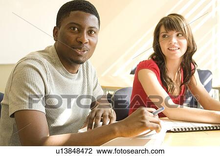 Portrait of 2 students seated at table, Winnipeg, Canada View Large Photo Image Stock Image - Portrait of 2 students seated at table, Winnipeg, Canada. Fotosearch