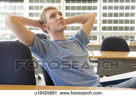 Portrait of male student in front of solar panelled windows, Winnipeg, Canada. View Large Photo Image Stock Image - Portrait of male student in front of solar panelled windows, Winnipeg, Canada.. Fotosearch