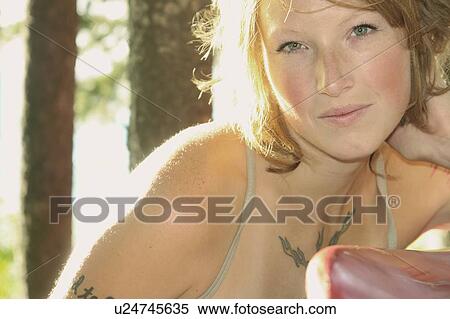 Portrait of woman in grove of trees, Riding Mountain National Park, Manitoba, Canada View Large Photo Image Stock Photography - Portrait of woman in grove of trees, Riding Mountain National Park, Manitoba, Canada. Fotosearch