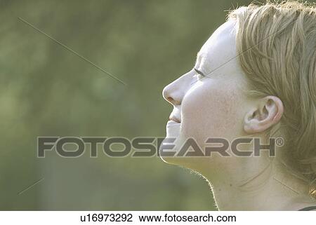 Profile of woman's face tilted upward, Grayling Lake, Riding Mountain National Park, Manitoba, Canada View Large Photo Image Stock Image - Profile of woman's face tilted upward, Grayling Lake, Riding Mountain National Park, Manitoba, Canada. Fotosearch