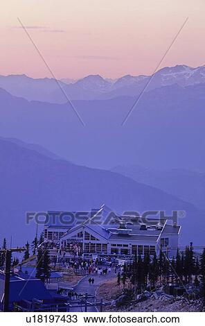 Stock Image - Purple and pink clouds over Rendezvous Lodge, Blackcomb Mtn.. Fotosearch