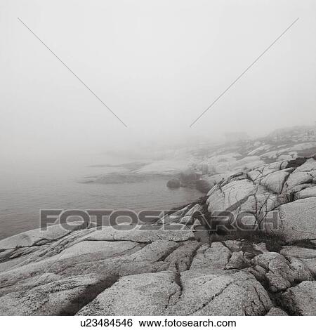 Stock Photograph - Rock Beach In Fog, Peggy's Cove, Nova Scotia.. Fotosearch