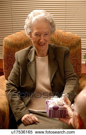 Senior Woman in Armchair; Canada, Saskatchewan, Regina View Large Photo Image Stock Photography - Senior Woman in Armchair; Canada, Saskatchewan, Regina. Fotosearch