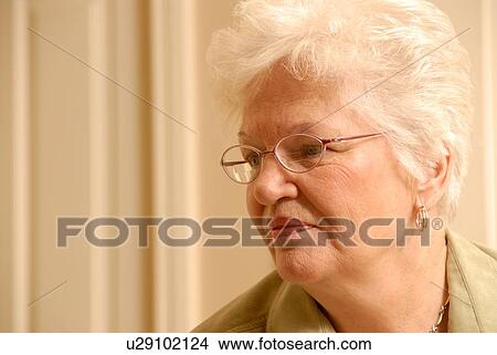 Picture - Senior Woman in chair; Canada, Saskatchewan, Regina. Fotosearch