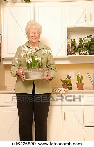 Senior Woman with plants, Regina, Saskatchewan View Large Photo Image Stock Image - Senior Woman with plants, Regina, Saskatchewan. Fotosearch