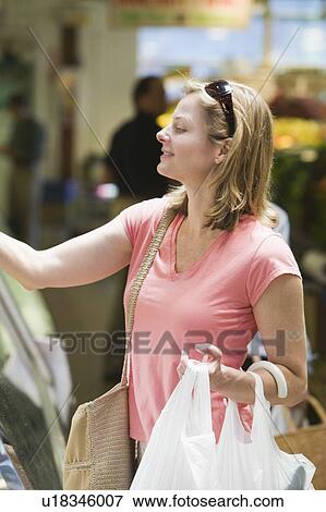 Stock Photo - Shopping on Granville Island, Vancouver, B. C.. Fotosearch