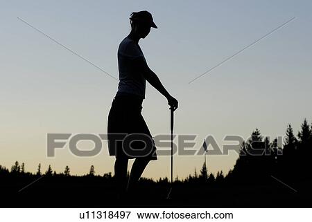 Silhouette of young woman on organic golf course, Clear Lake Golf Course, Riding Mountain National Park, Manitoba, Canada View Large Photo Image Stock Photo - Silhouette of young woman on organic golf course, Clear Lake Golf Course, Riding Mountain National Park, Manitoba, Canada. Fotosearch
