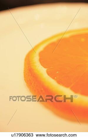 Slice of orange on plate View Large Photo Image Stock Image - Slice of orange on plate. Fotosearch