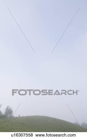 Small cross at crest of hill in mist, Saskatchewan, Canada View Large Photo Image Stock Photo - Small cross at crest of hill in mist, Saskatchewan, Canada. Fotosearch