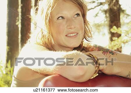 Smiling woman looks upward, Riding Mountain National Park, Manitoba, Canada View Large Photo Image Stock Photo - Smiling woman looks upward, Riding Mountain National Park, Manitoba, Canada. Fotosearch