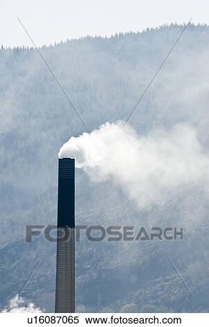 Steam comes from a smokestack at a smelter in BC View Large Photo Image Stock Photography - Steam comes from a smokestack at a smelter in BC. Fotosearch