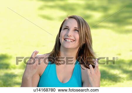 Stock Image - Teenage girl in park, Regina, Saskatchewan. Fotosearch