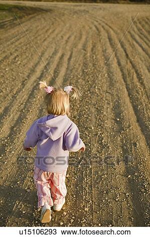 Three year old girl on bare field, Saskatchewan, Canada View Large Photo Image Stock Image - Three year old girl on bare field, Saskatchewan, Canada. Fotosearch