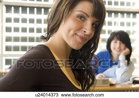Two female students in classroom, in front of solar panelled windows, Winnipeg, Canada View Large Photo Image Stock Image - Two female students in classroom, in front of solar panelled windows, Winnipeg, Canada. Fotosearch