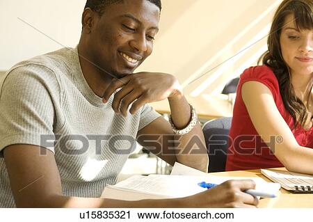 Two students seated at table, Winnipeg, Canada View Large Photo Image Stock Image - Two students seated at table, Winnipeg, Canada. Fotosearch