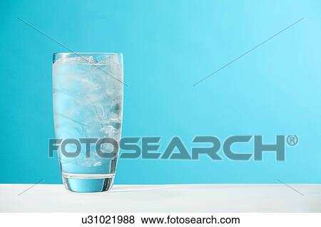 Very full glass of water with ice View Large Photo Image Stock Photo - Very full glass of water with ice. Fotosearch