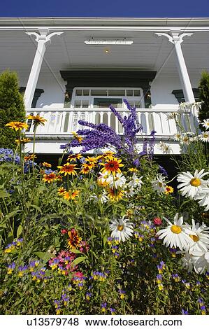 Stock Photo - View of Auberge Manoir Tache (Inn) and flowers, Bas-Saint-Laurent region, Quebec, Canada. Fotosearch