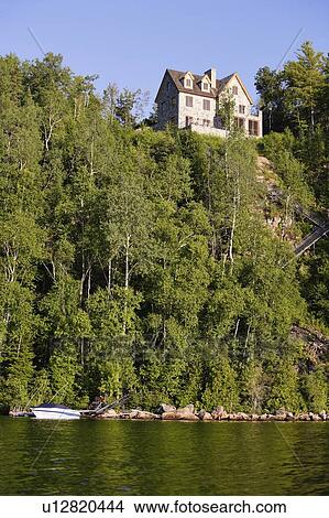 View of lake Sacacomie and house, Quebec, Canada View Large Photo Image Picture - View of lake Sacacomie and house, Quebec, Canada. Fotosearch