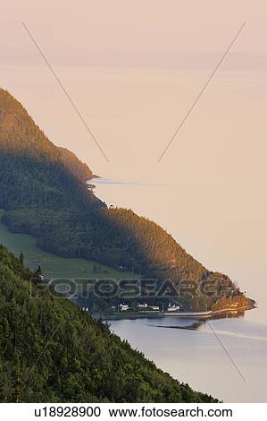 Stock Image - View of Saint-Fabien-sur-Mer and St. Lawrence river at sunrise.. Fotosearch