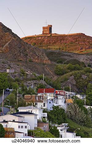 View of The Battery and Cabot Tower (Signal Hill National Historic Site) at sunset, St. John's, Newfoundland, Canada View Large Photo Image Stock Image - View of The Battery and Cabot Tower (Signal Hill National Historic Site) at sunset, St. John's, Newfoundland, Canada. Fotosearch