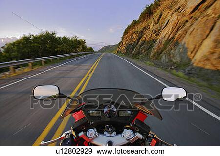 Stock Photo - View on Motorcycle in action on Cabot Trail, Cape Breton Highlands National Park, Nova Scotia, Canada. Fotosearch