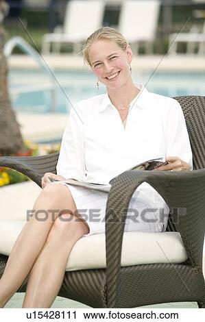 Woman (35) reading a magazine, Jacksonville, Florida View Large Photo Image Stock Image - Woman (35) reading a magazine, Jacksonville, Florida. Fotosearch