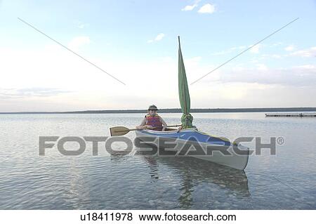 Woman in kayak Clear Lake Riding Mt. Nat. Park; Canada, Manitoba, Riding Mountain National Park View Large Photo Image Stock Photo - Woman in kayak Clear Lake Riding Mt. Nat. Park; Canada, Manitoba, Riding Mountain National Park. Fotosearch