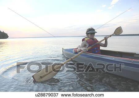 Woman in kayak Clear Lake Riding Mt. Nat. Park; Canada, Manitoba, Riding Mountain National Park View Large Photo Image Stock Photo - Woman in kayak Clear Lake Riding Mt. Nat. Park; Canada, Manitoba, Riding Mountain National Park. Fotosearch