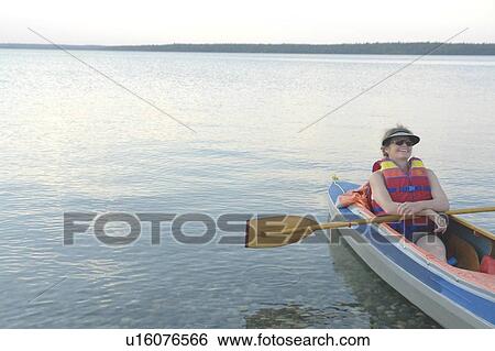 Woman in kayak Clear Lake Riding Mt. Nat. Park; Canada, Manitoba, Riding Mountain National Park View Large Photo Image Stock Photograph - Woman in kayak Clear Lake Riding Mt. Nat. Park; Canada, Manitoba, Riding Mountain National Park. Fotosearch