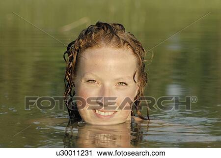 Woman in lake, smiling, Lake Katherine, Riding Mountain National Park, Manitoba, Canada View Large Photo Image Stock Image - Woman in lake, smiling, Lake Katherine, Riding Mountain National Park, Manitoba, Canada. Fotosearch
