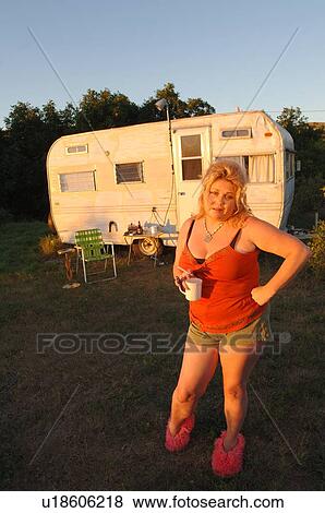 Woman in slippers beside run-down trailer; Canada, Saskatchewan, Cypress Hills View Large Photo Image Stock Photo - Woman in slippers beside run-down trailer; Canada, Saskatchewan, Cypress Hills. Fotosearch
