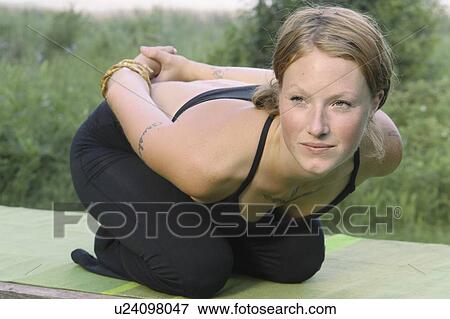 Woman in yoga pose, beside Grayling Lake, Riding Mountain National Park, Manitoba, Canada View Large Photo Image Stock Photo - Woman in yoga pose, beside Grayling Lake, Riding Mountain National Park, Manitoba, Canada. Fotosearch